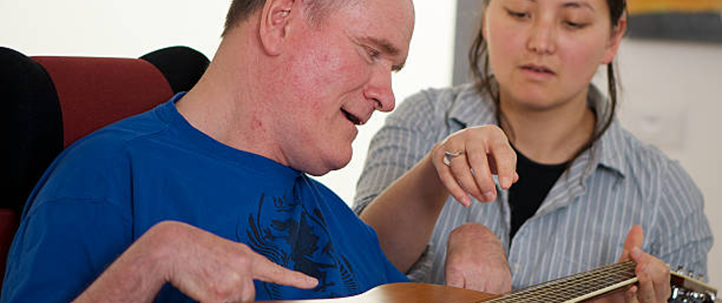 Woman working with a male patient