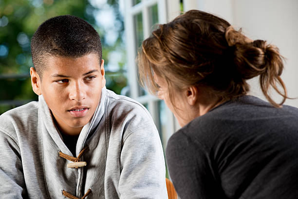 Counsellor talking to a teenager.
