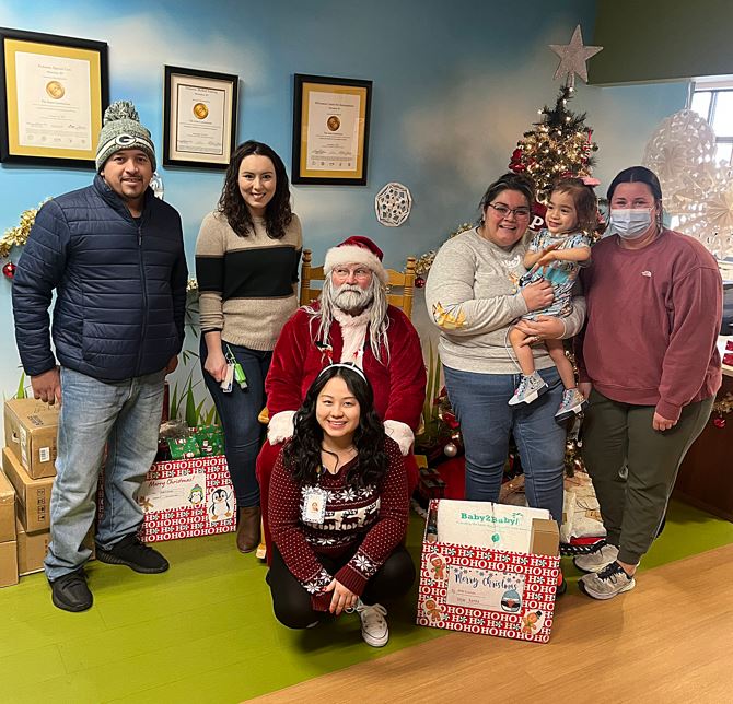 Santa Claus visits CFI's Medical Day Care to handout presents.