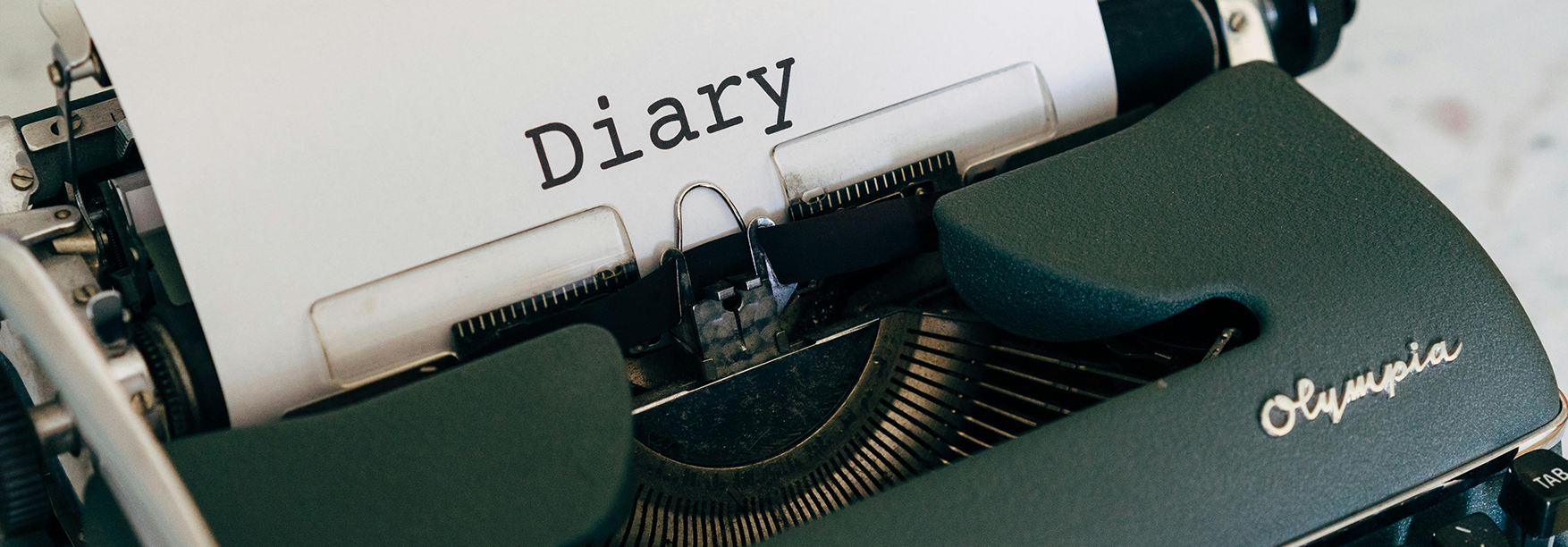 image of typewriter with diary on paper